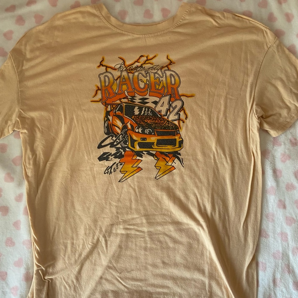 oversized cream colored “racer” t-shirt